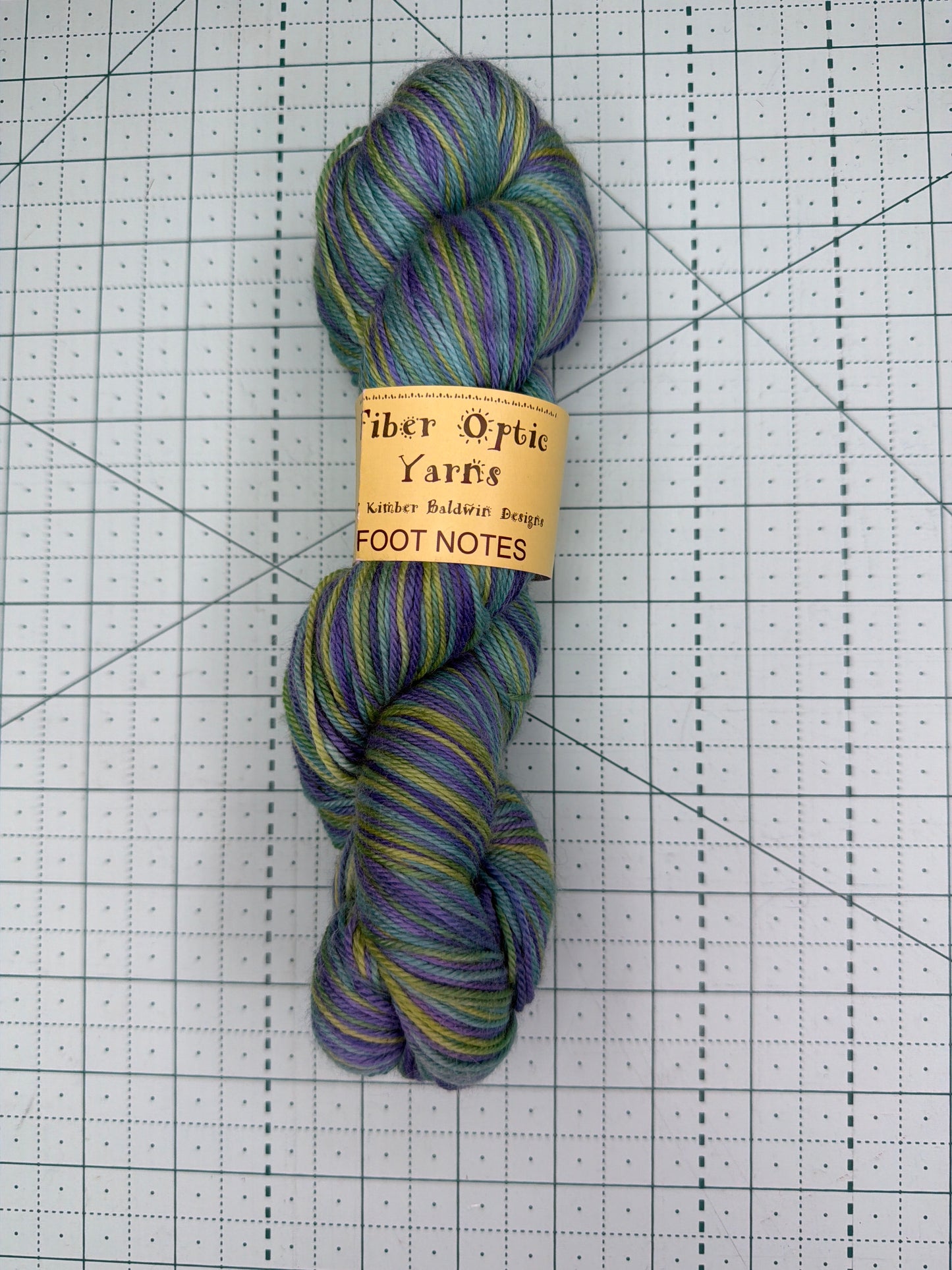 Hand dyed fingering weight yarn by fiber optic yarns