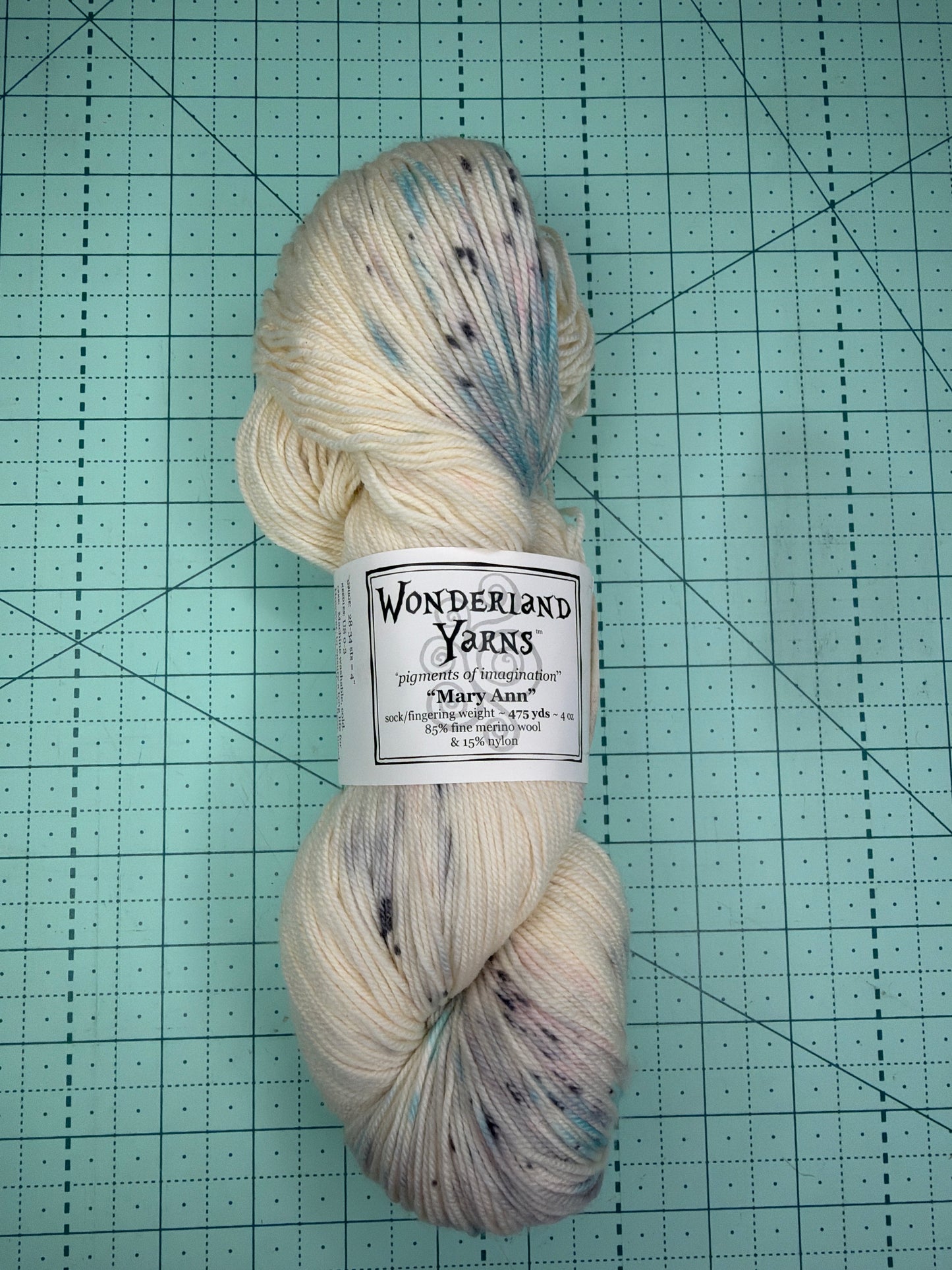Hand dyed fingering weight yarn by Wonderland yarns